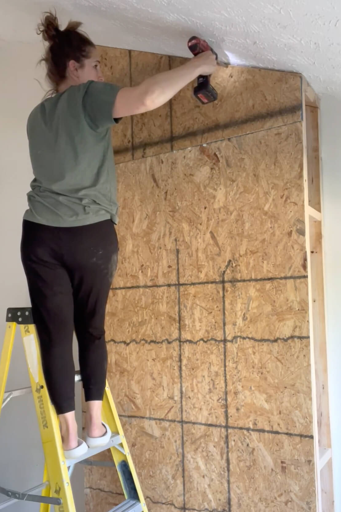 Sheeting a fireplace surround with OSB.